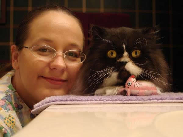 One of many Valentine's Days with Miss Romeo. She was my first housecall groom kitty in 2001.